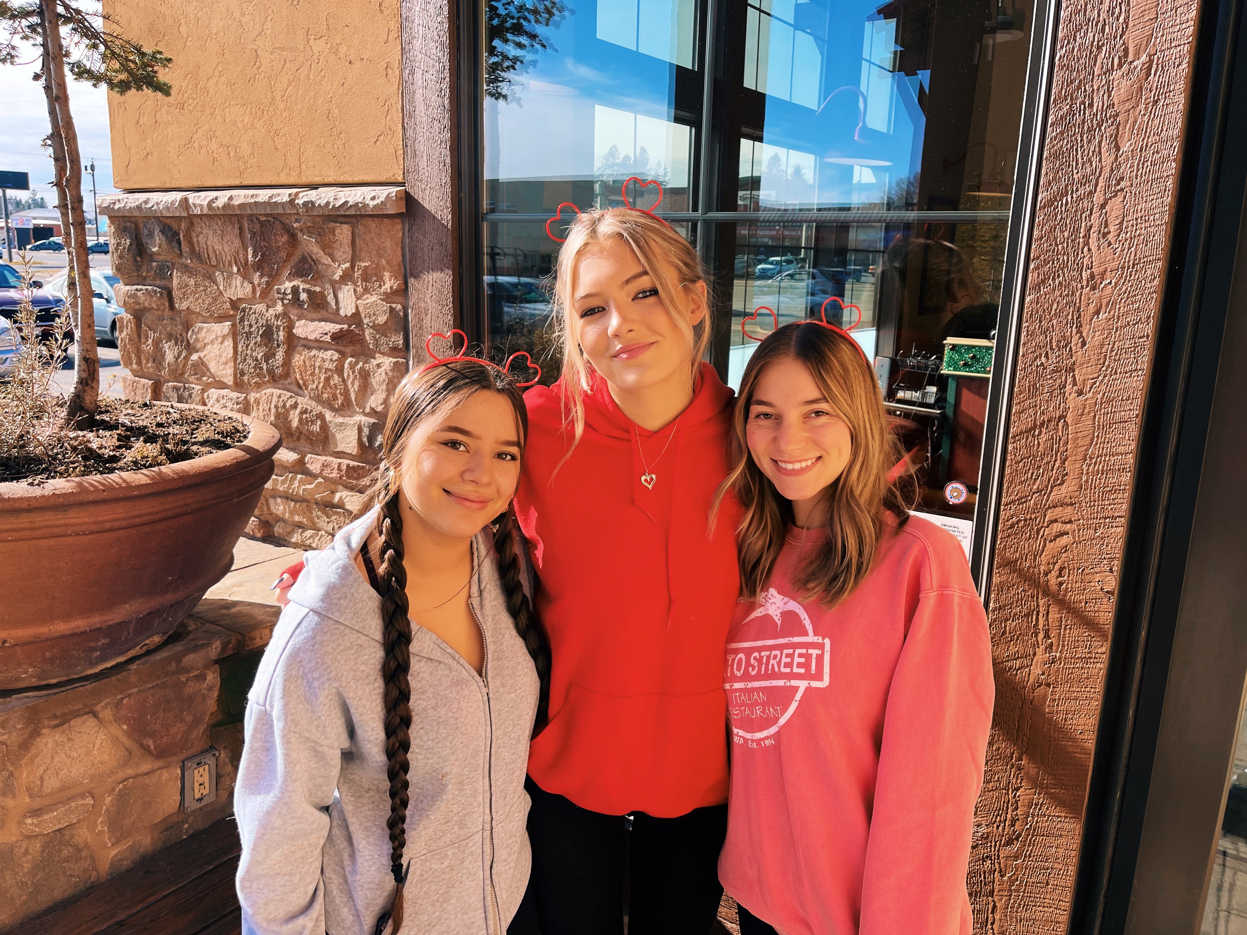 Three Tomato Street Hostesses standing together outside the restaurant