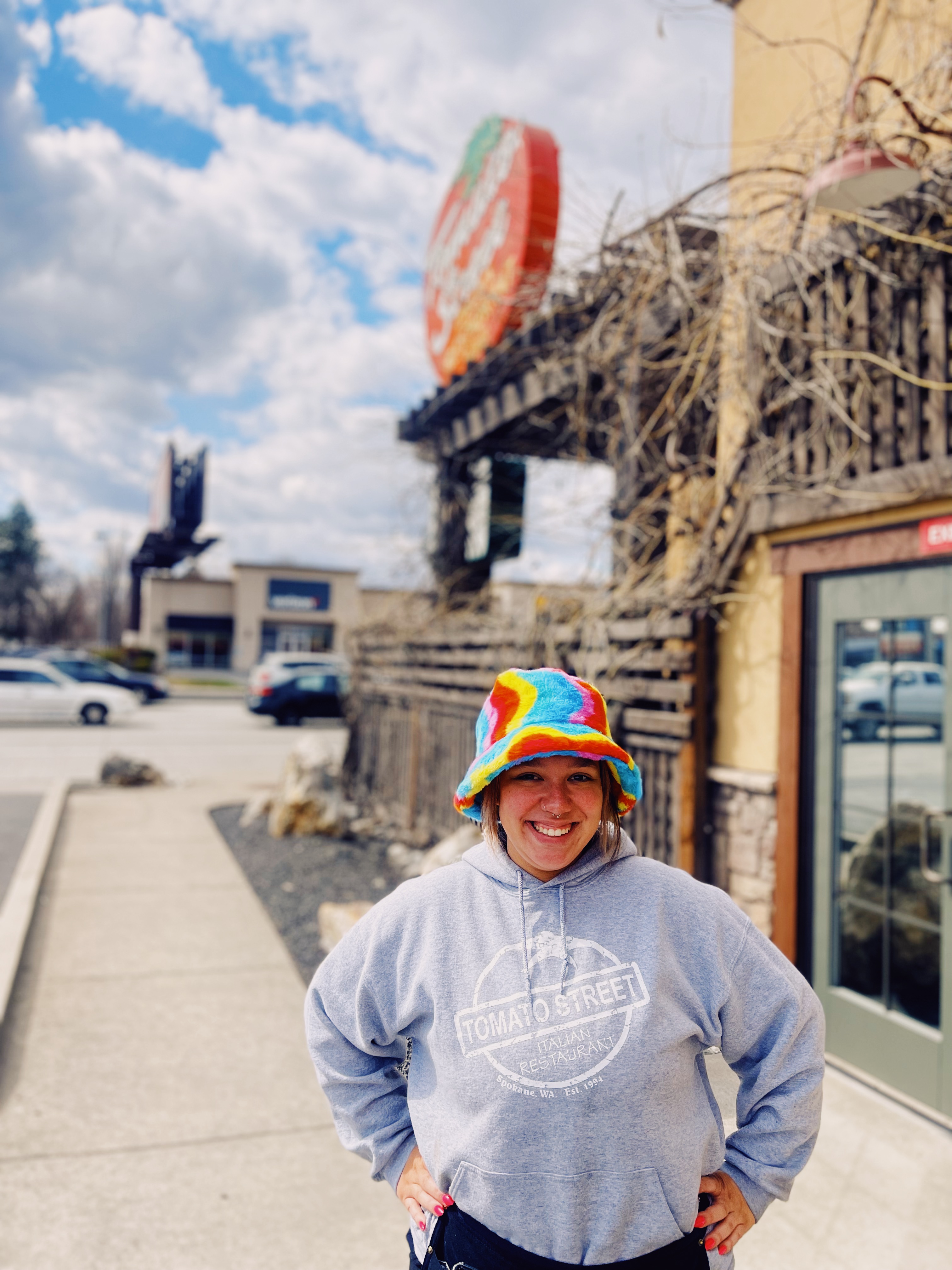 Tomato Street Employee standing outside of the restaurant