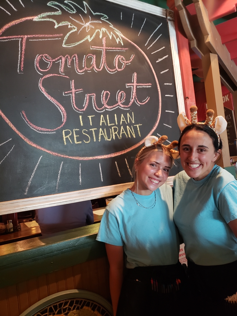 Two Tomato Street Employees standing together inside the restaurant